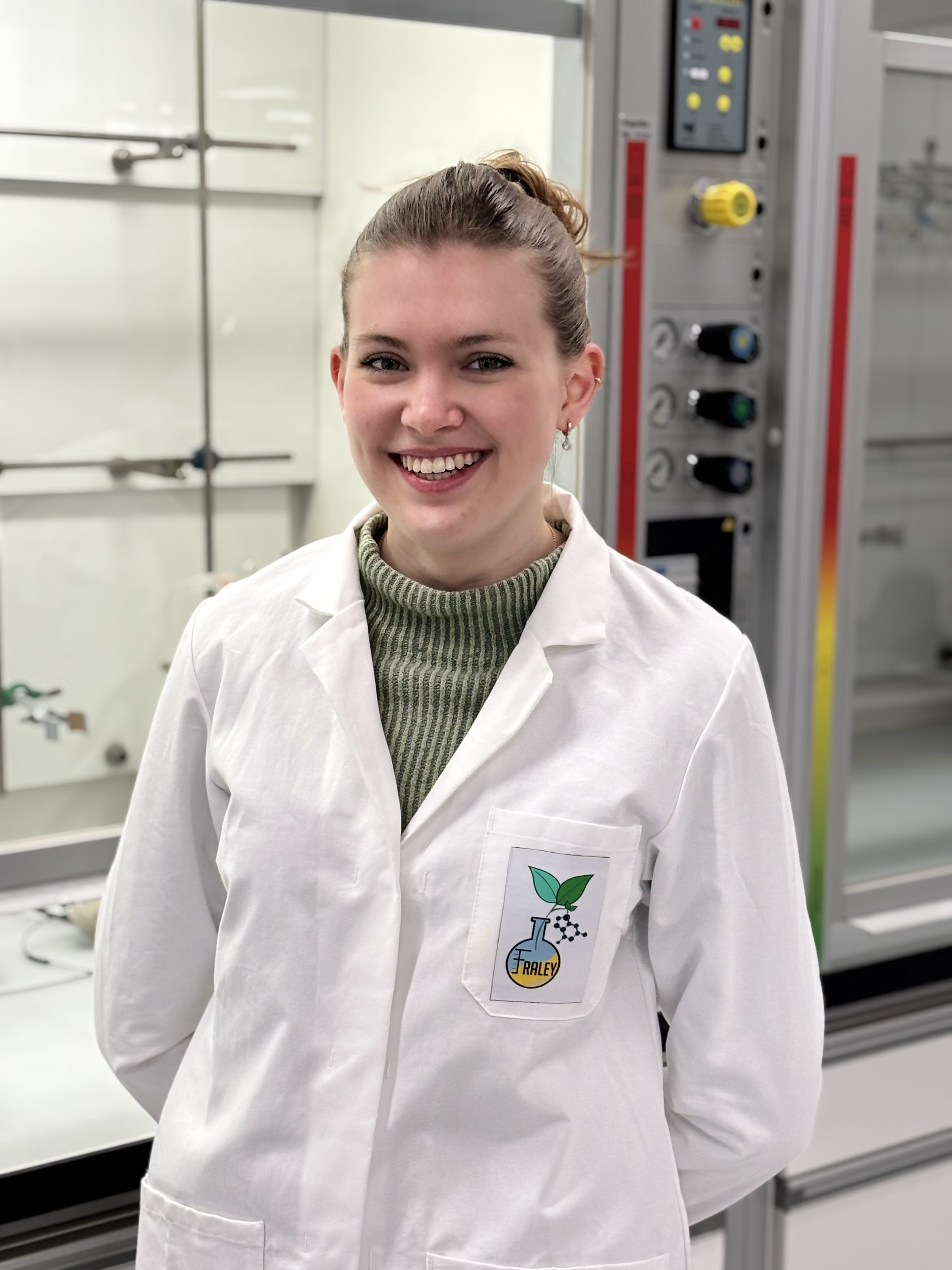 Anita Berg standing in the lab after passing her aptitude colloquium